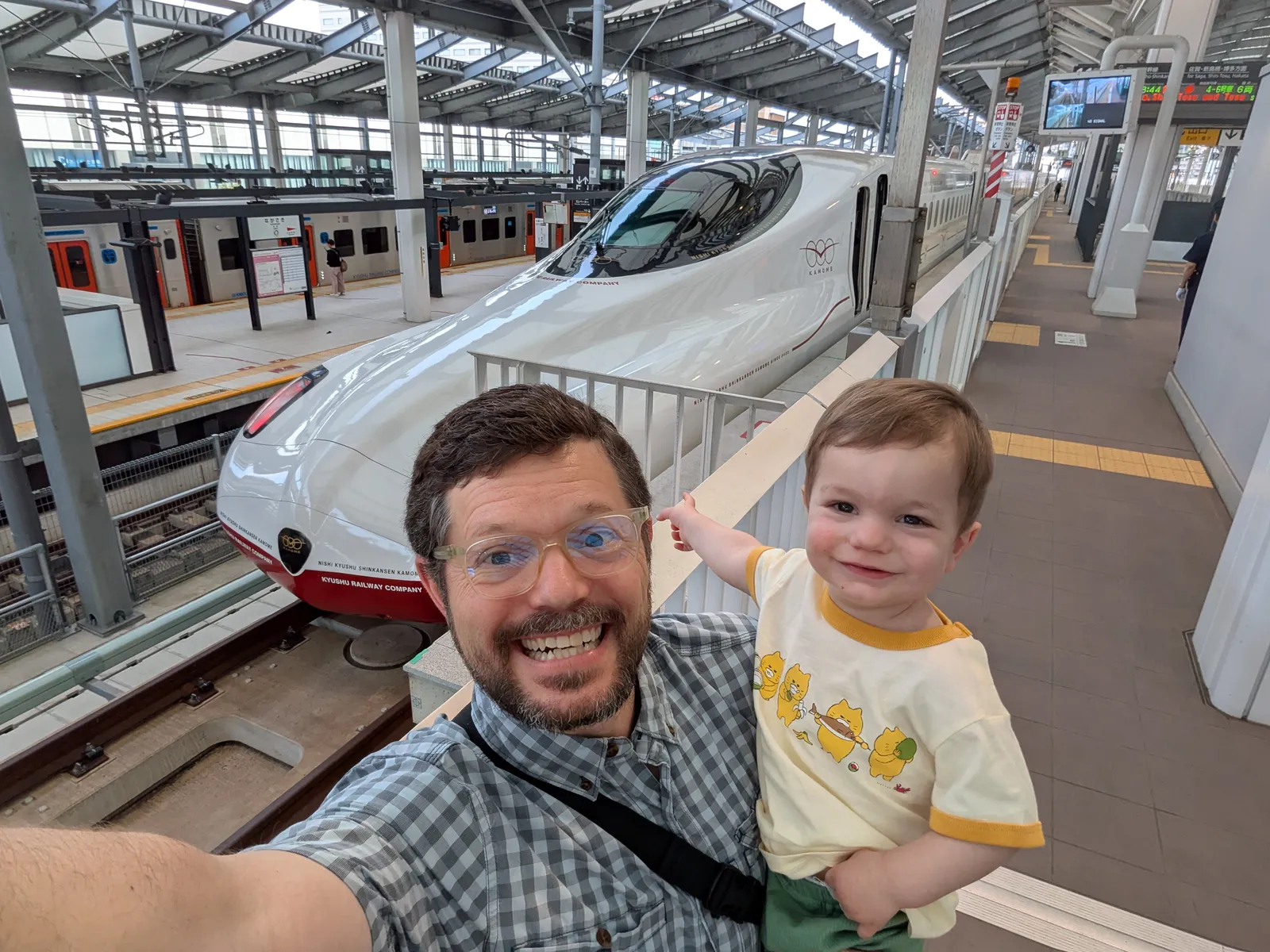 Mikey and Dad in front of bullet train